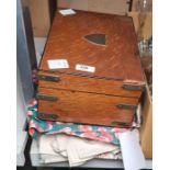 Brass cornered sewing box and contents, a quantity of materials, offcuts and two suitcases
