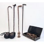 Set of four wooden bowls in carry case, a collection of five walking canes, one with silver