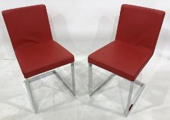 Set of four red modern cantilever chairs on chrome bases, red leather seats and backs (4)