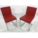 Set of four red modern cantilever chairs on chrome bases, red leather seats and backs (4)