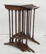 20th century mahogany nest of four tables, on turned supports, stretchered bases