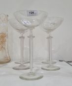 Five modern stemmed saucer champagnes with frilled knop and tapering multiple air twist stem