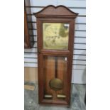 20th century oak rectangular weight-driven wall clock with brass Roman numeral dial, inscribed 'S