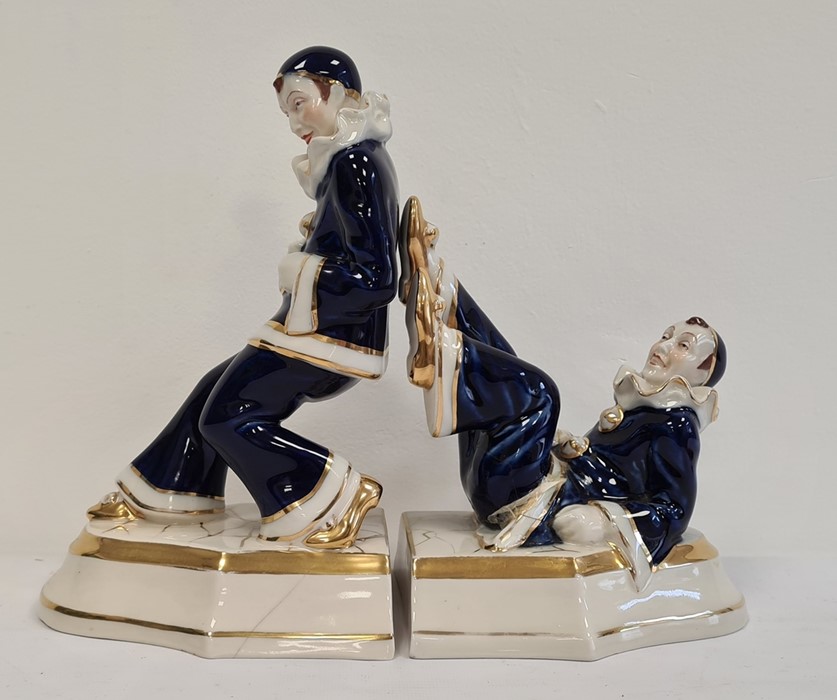 Pair of glazed pottery Royal Dux bookends styled as a pair of Pierrots (2)  Condition ReportThe