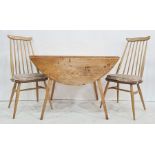Early Ercol elm-topped drop-leaf table on beech base and four Ercol elm-seated and beech spindleback