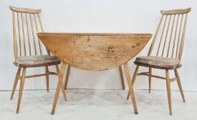 Early Ercol elm-topped drop-leaf table on beech base and four Ercol elm-seated and beech spindleback