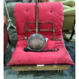 Single futon bed, copper warming pan, vintage coping saw, and a wooden shillelagh