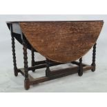 Late 19th/early 20th century oak gateleg table on bobbin turned supports to block feet,