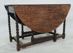 Late 19th/early 20th century oak gateleg table on bobbin turned supports to block feet,