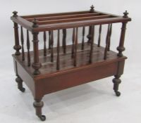 Modern mahogany three-section Canterbury with single drawer under, turned supports to castors