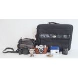 Paxette Reflex camera, a Minolta camera and lens in carry case, a Vivitar digital camera in blue