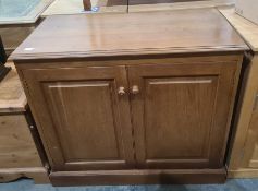 20th century oak two-door cupboard, the rectangular top with moulded edge above two panelled