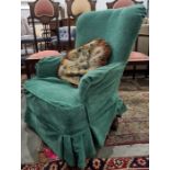 Armchair in pale green loose covers