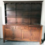 Possibly early 20th century large hardwood dresser with two plate shelves above three drawers,