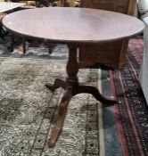 Late 19th/early 20th century circular centre table, with quarter cut oak top on baluster turned