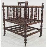 Early 19th century stained beech four-section canterbury of bobbin turned design, having centre