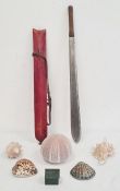 Steel sword with stained red hide sheath and various shells