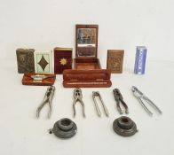 Collection of various metal nutcrackers, gramophone parts, a leather purse, miniature book of common