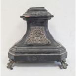 Ebonised stand with metal relief mounts, on scroll shaped feet, 27cm high