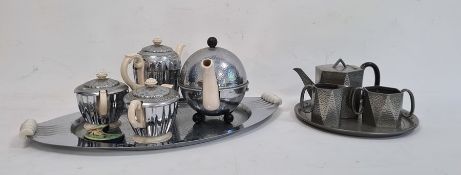 Regent Heatmaster three-piece tea set, another Heatmaster teapot, an oval tray, a crescent-shaped