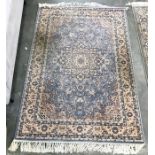 A Persian style wool rug,  light blue ground all over, floral decoration in pink, cream and dark