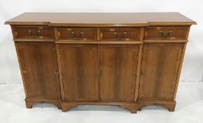 20th century yew breakfront sideboard with four drawers above four cupboard doors, bracket feet,