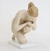 Rosenthal tinted bisque kneeling porcelain figure of a female nude, 16.5cm long