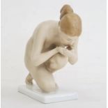 Rosenthal tinted bisque kneeling porcelain figure of a female nude, 16.5cm long