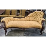 Victorian mahogany spoon-back chaise longue with yellow foliate buttonback upholstery, serpentine