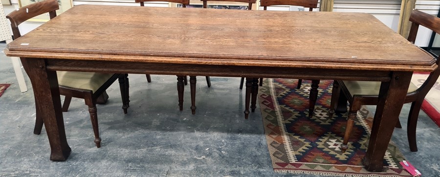 Late 19th/early 20th century oak dining table, the rectangular top with canted corners, moulded