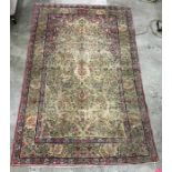 Cream ground Persian rug with Tree of Life decoration, with pink ground upper spandrels, on a