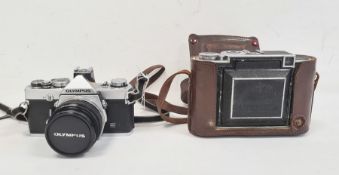 Olympus OM-1 camera and a Zeiss Ikon Super Ikonta in brown leather case (2)  Condition