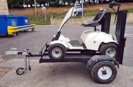 Grasshopper Classic four-wheel single person electric golf buggy on purpose built trailer, with