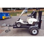 Grasshopper Classic four-wheel single person electric golf buggy on purpose built trailer, with