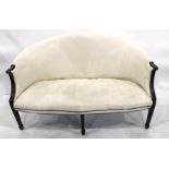 Early 20th century two-seat sofa in cream ground upholstery, reeded arm rests, on square section