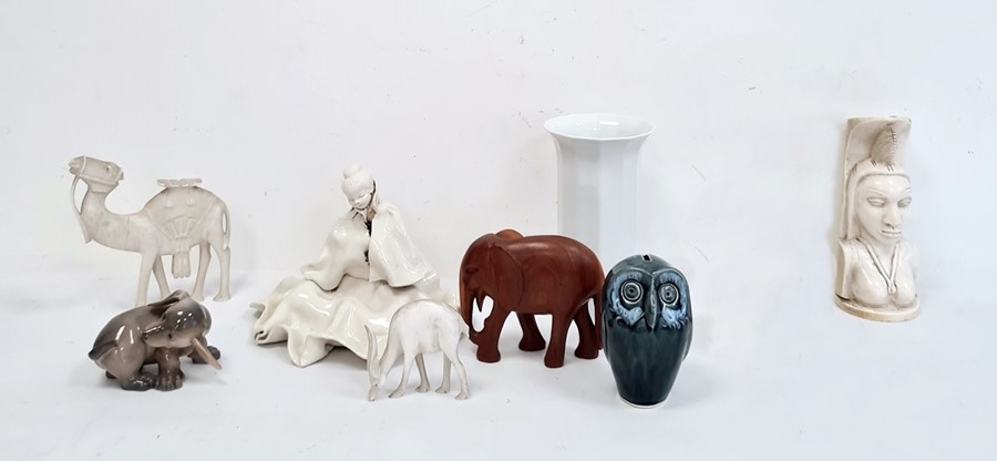 Royal Copenhagen model of a puppy, no.1238/1407, a pottery model of an owl, a carved elephant, a