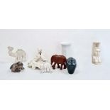 Royal Copenhagen model of a puppy, no.1238/1407, a pottery model of an owl, a carved elephant, a