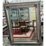Large 20th century rectangular mirror with bevel edge, moulded and silver-coloured painted frame,