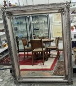 Large 20th century rectangular mirror with bevel edge, moulded and silver-coloured painted frame,