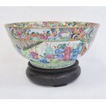 19th century Chinese Canton porcelain punchbowl painted with figures in interior and gardens,