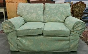 Two two-seater sofas and single armchair in pale green foliate pattern upholstery