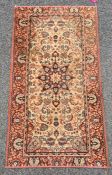 A modern  Persian style rug, cream ground,  central flower- shaped medallion, floral decorated in