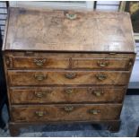 18th century mahogany and banded bureau, the fall with brass escutcheon, fitted interior above two