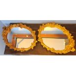 Two 20th century gilt-framed oval mirrors (2)