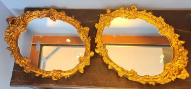 Two 20th century gilt-framed oval mirrors (2)