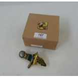 Alexandra Abraham brooch in gilt, turquoise and green, in original box, with relief decoration to
