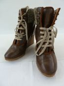 Pair of Chloe leather wedge heeled and knitted walking boots with studs and lace fastening, in