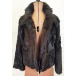 DKNY black fur goat shearling jacket with leather trim to the pockets, size M
