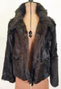 DKNY black fur goat shearling jacket with leather trim to the pockets, size M