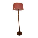 20th century standard lamp with large red shade, on circular base